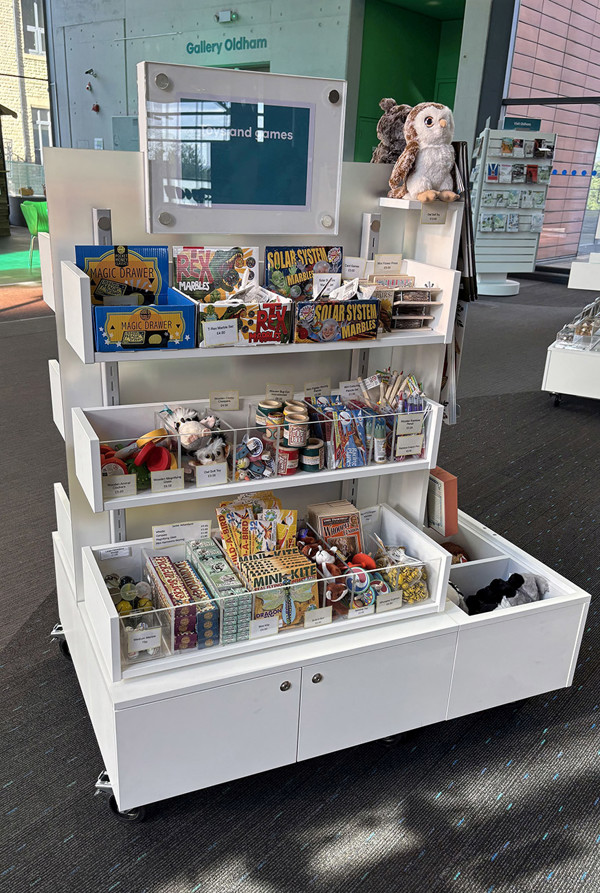 Mobile display unit filled with colourful toys and games at Oldham Library & Gallery Shop – toys and games