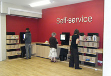 RFID self-service library design — kiosk housing with book return shelves integrated into library entrance