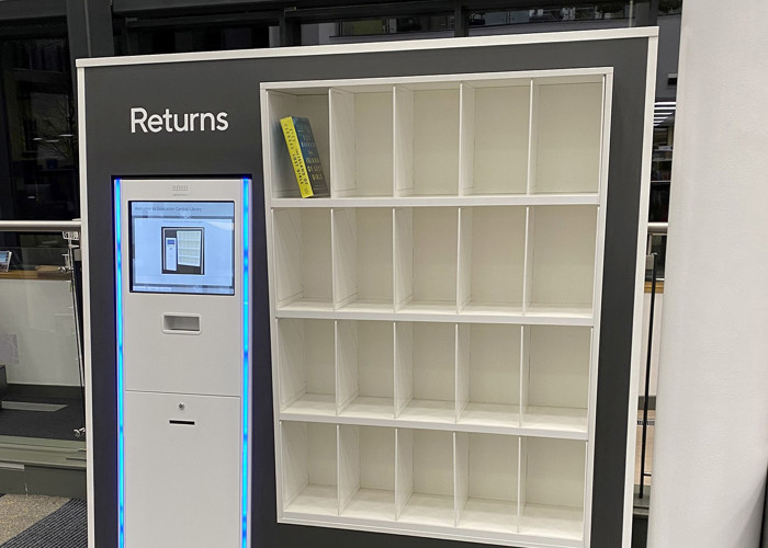 RFID self-service library design — kiosk housing with book return shelves integrated into library entrance