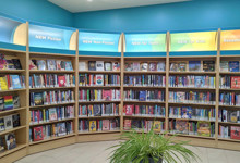 Large public library interior design — open plan shelving and reading areas in a central library refurbishment