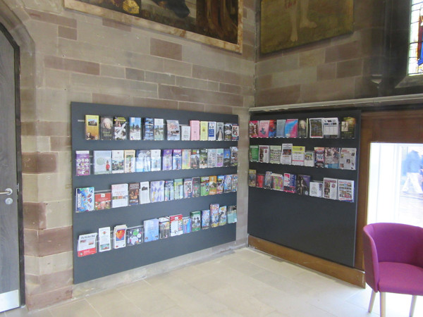 Wall-mounted leaflet displays filled with brochures and information at Lichfield Library