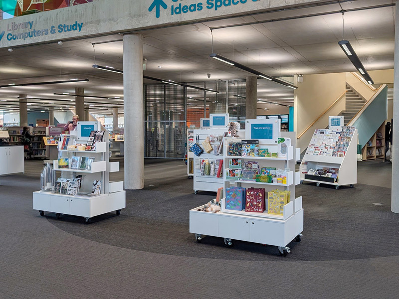 Library shop design — mobile retail merchandising unit with books and gifts for sale