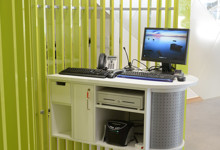 Council contact and advice library design — customer service zone with advice desks and waiting area at Southwater Library