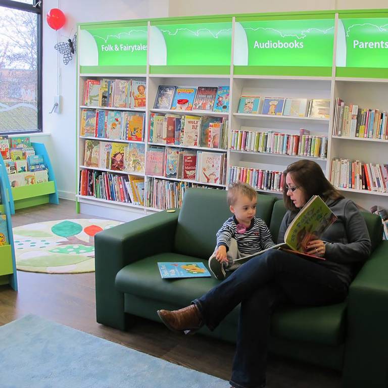 Sharing a book, South Woodford Library