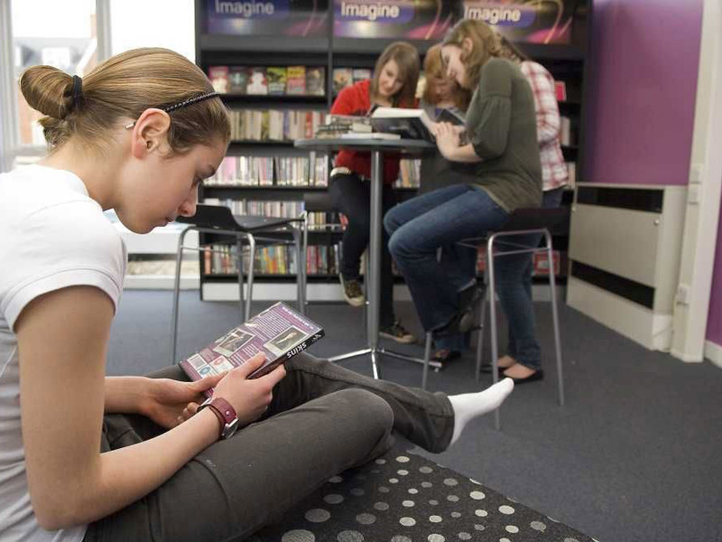 Teen library zone design — young people's library space with defined seating area