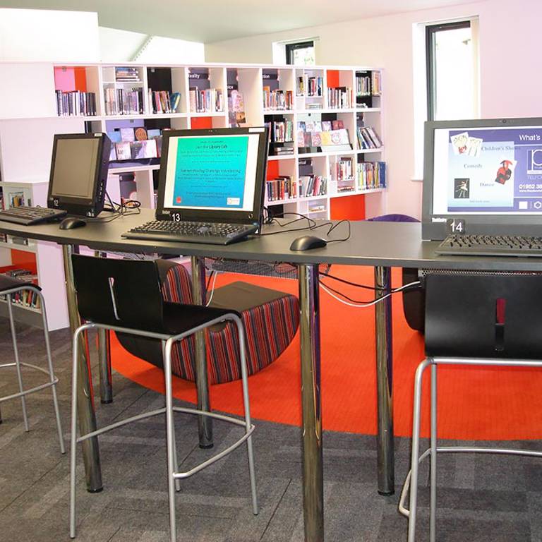 Bar-height IT desk and accent flooring define teensâ€™ area, Wellington Library