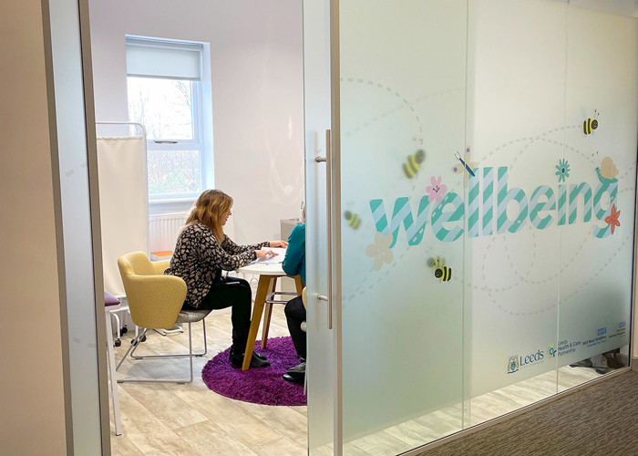 Library wellbeing zone design — families using a health and wellbeing space in a public library