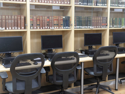 Four black ergonomic chairs in front of computer workstations at a digital study area at Gateshead Archive Library