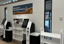 RFID self-service library design — kiosk housing with book return shelves integrated into library entrance