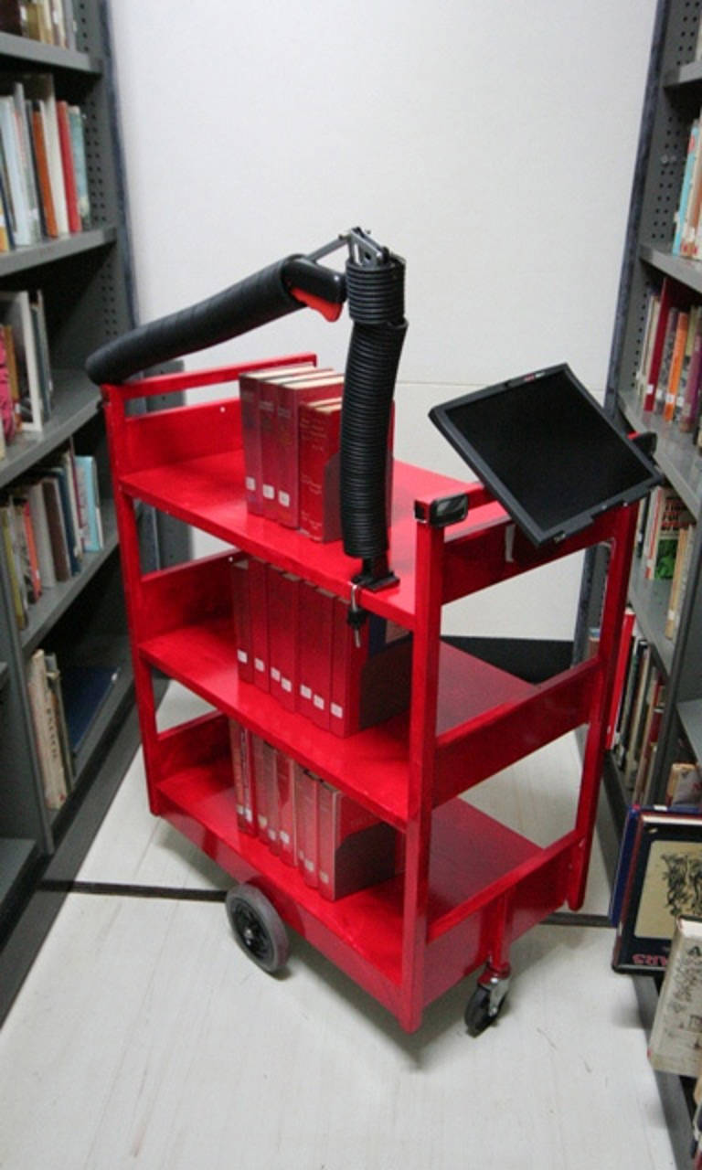 The German book cart of the future – according to a youth library group - needs a robotic arm for re-shelving and a rear view mirror.
