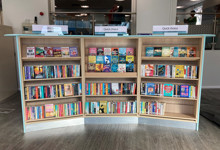 Library browsing layout design — curved face-out shelving and book merchandising zone