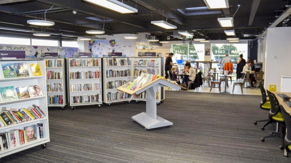 Face-out book displays and browsing shelves in a public library browsing area at Aireborough Library