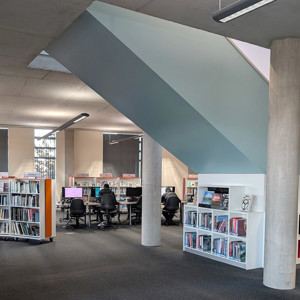 Large format books under stairs