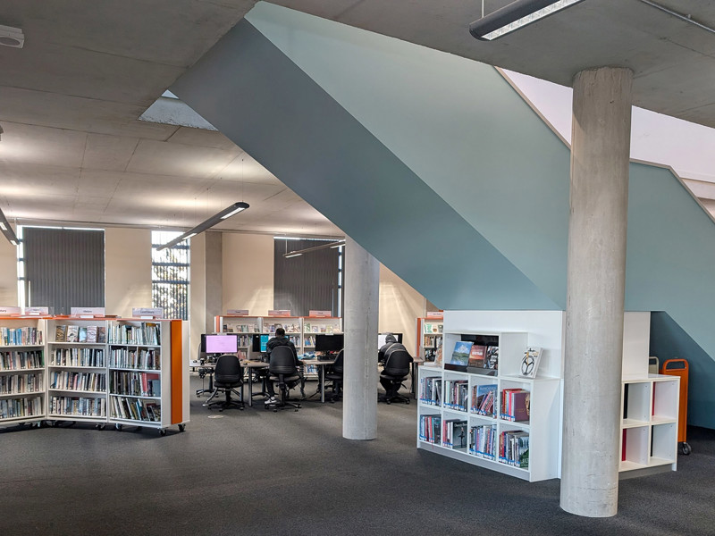 Large format books under stairs