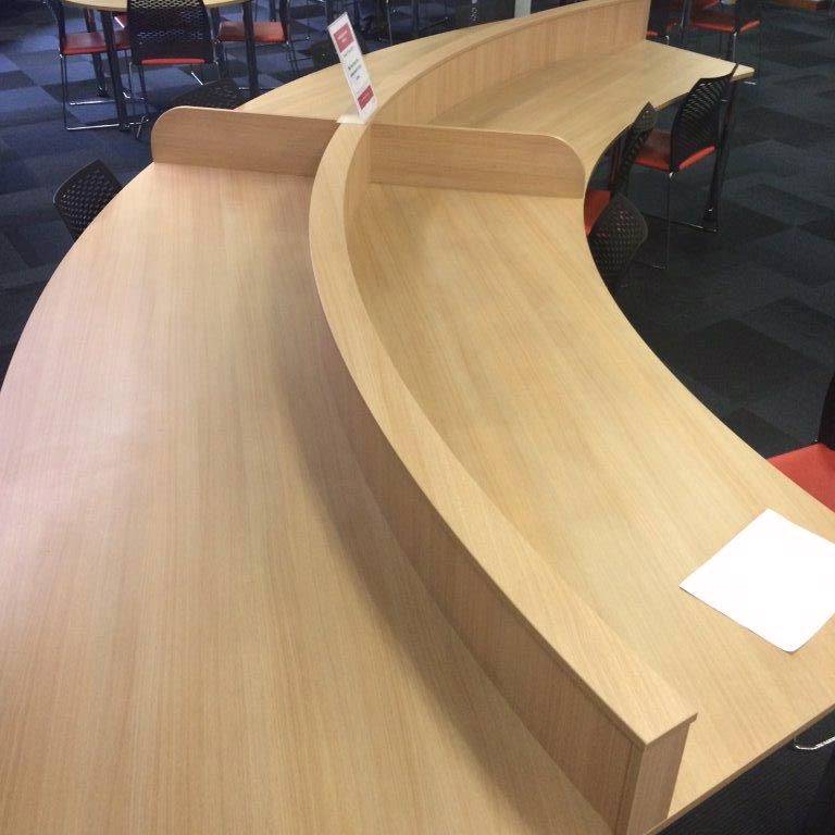 Curved IT desksCurved desk with central divider to define shared space