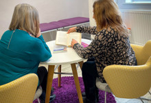 Library wellbeing zone design — families using a health and wellbeing space in a public library
