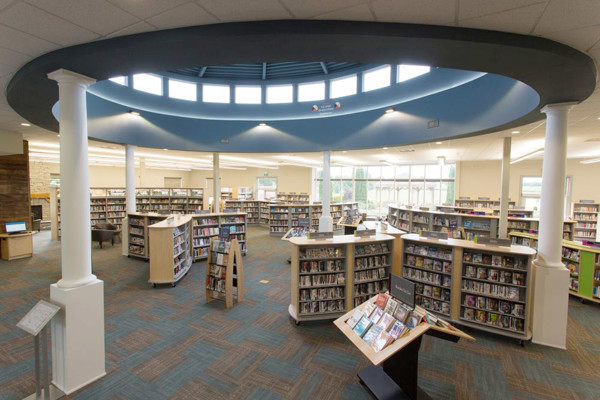 Circular skylight and open-plan shelving create a spacious browsing area at Niagara On The Lake Library