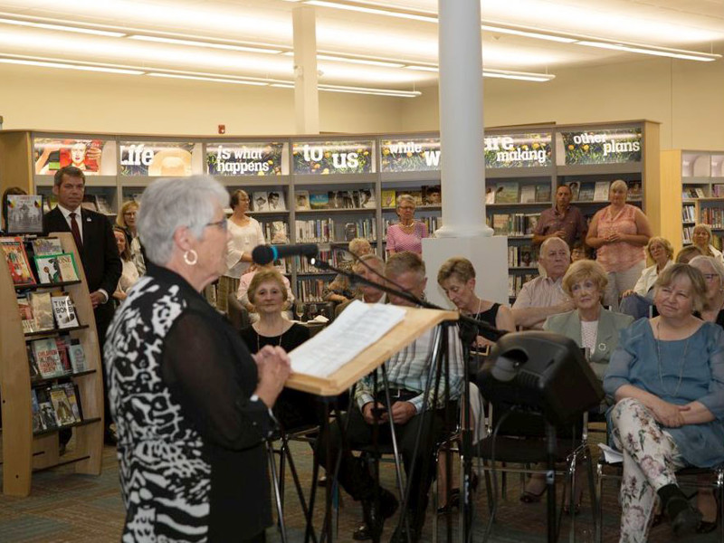 Event in front of book display wall