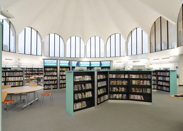 Large public library interior design — open plan shelving and reading areas in a central library refurbishment
