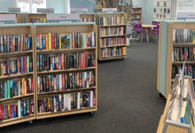Library browsing layout design — curved face-out shelving and book merchandising zone