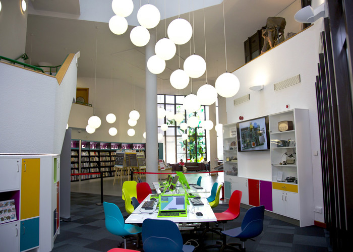 Library makerspace design with custom tables, equipment storage and colourful maker zone furniture
