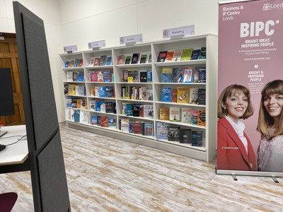 Colourful resource displays featuring business books and guides in a study area at BIPC Leeds