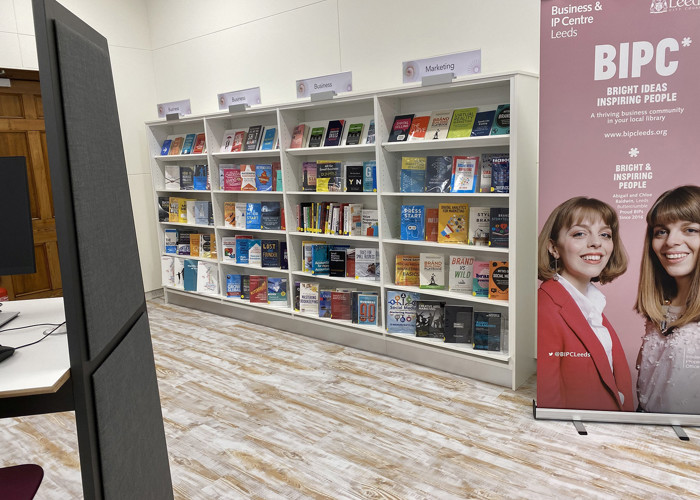 Library workspace design — co-working seating area in a public library business support zone