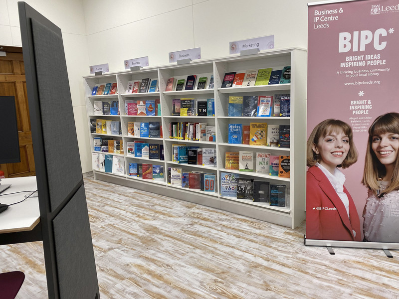 Colourful resource displays featuring business books and guides in a study area at BIPC Leeds
