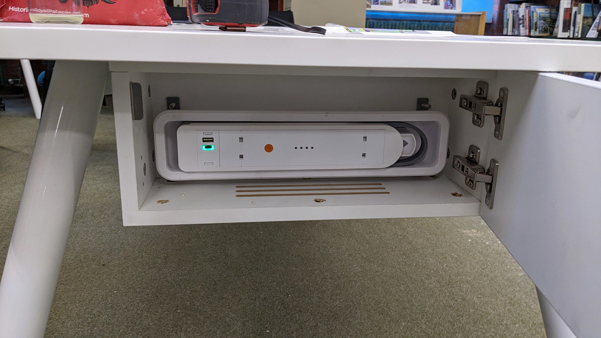 Custom cable management system integrated into a study table at Abingdon Library
