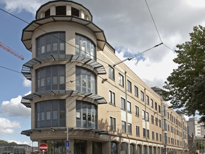 Modern architectural features and large windows on a historic building façade at Boots Library