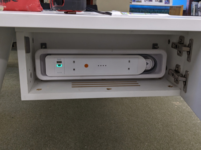 Abingdon Library - battery in lockable cupboard supports desktop power and is removed to charge overnight in staffroom
