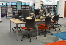 Heritage library interior design — vaulted stone arches and modern shelving in a historic library refurbishment