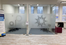 Library workspace design — co-working seating area in a public library business support zone