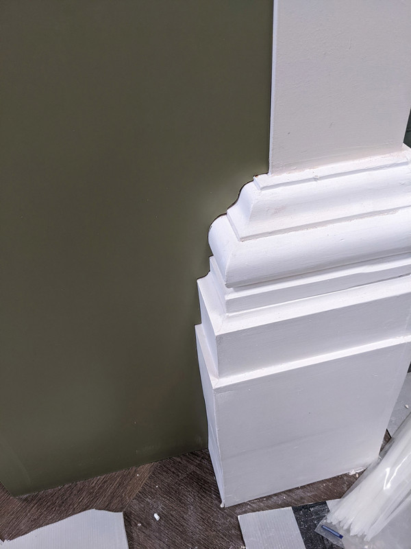 Detailed architectural moulding seamlessly integrated around a structural column at Tunstall Library